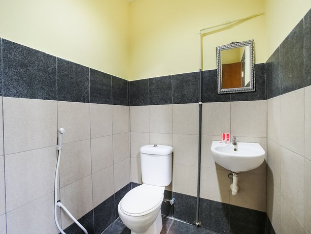 Imagen de la habitación del Hotel OYO 89585 Happy Inn. Foto 14