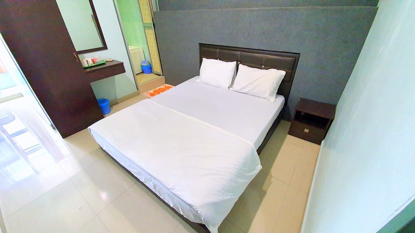 Imagen de la habitación del Hotel OYO 89737 Tishoa. Foto 5