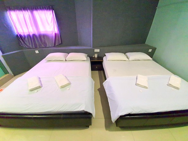 Imagen de la habitación del Hotel OYO 89737 Tishoa. Foto 8