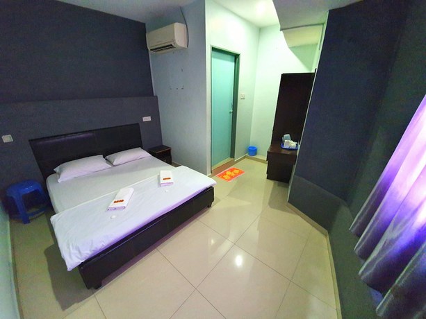 Imagen de la habitación del Hotel OYO 89737 Tishoa. Foto 11