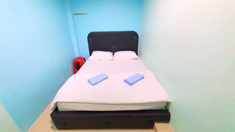 Imagen de la habitación del Hotel OYO 89737 Tishoa. Foto 12