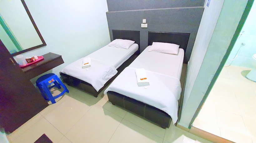 Imagen de la habitación del Hotel OYO 89737 Tishoa. Foto 13