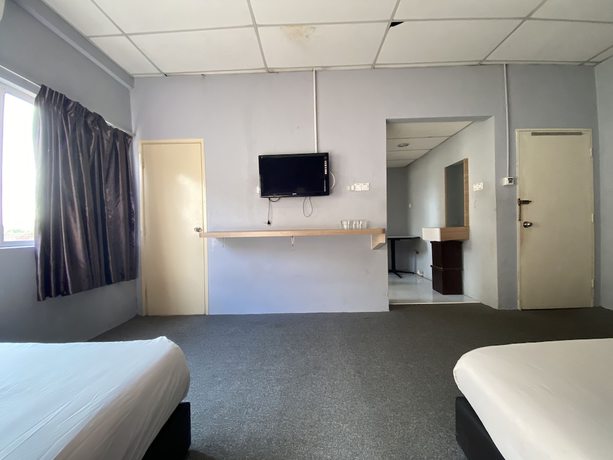 Imagen de la habitación del Hotel OYO 89760 Harmoni Inn. Foto 4