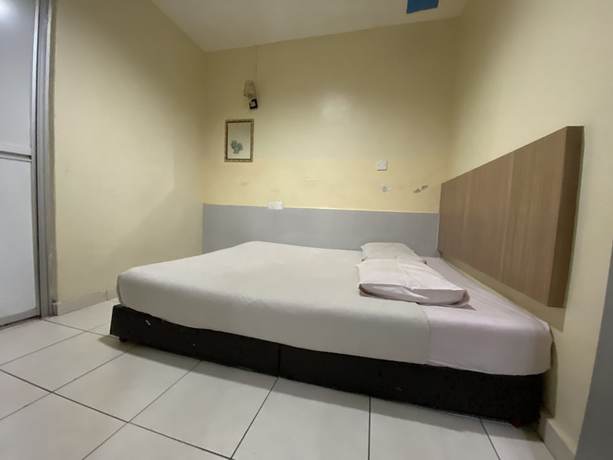 Imagen de la habitación del Hotel OYO 89760 Harmoni Inn. Foto 7