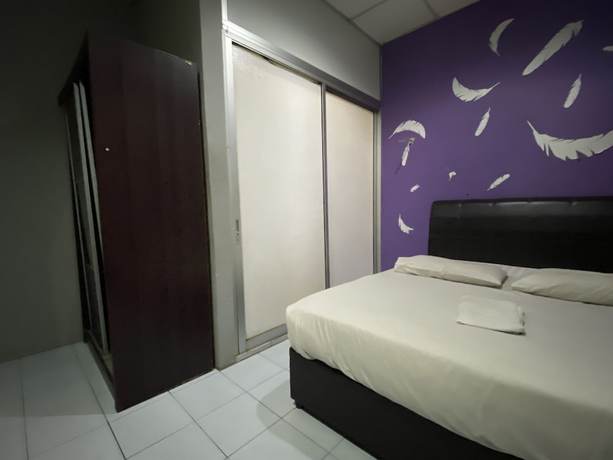 Imagen de la habitación del Hotel OYO 89760 Harmoni Inn. Foto 8