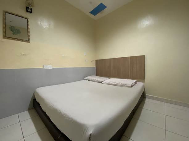 Imagen de la habitación del Hotel OYO 89760 Harmoni Inn. Foto 9