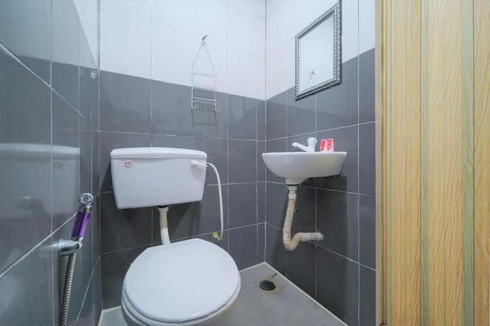 Imagen de la habitación del Hotel OYO 89820 SP Berlian Inn. Foto 4