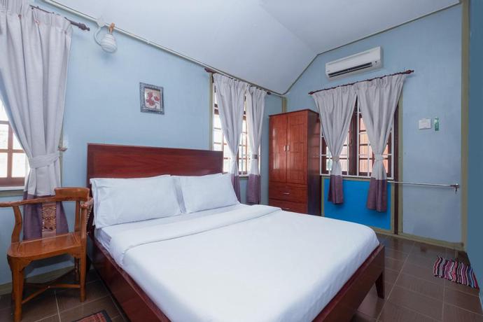 Imagen de la habitación del Hotel OYO 89873 Nurbayu Chalet. Foto 5