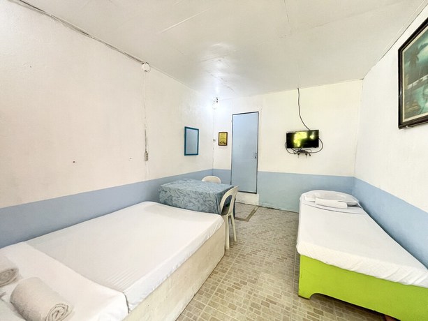 Imagen de la habitación del Hotel OYO 899 Merie Diz Sunrise Beach Resort. Foto 4