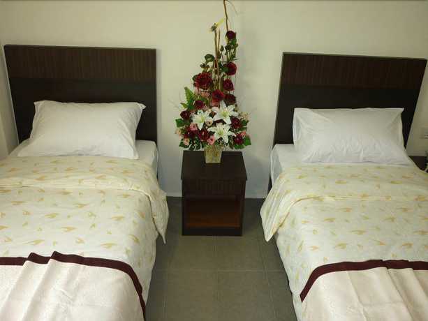 Imagen de la habitación del Hotel OYO 89948 Hotel Masai Utama. Foto 6