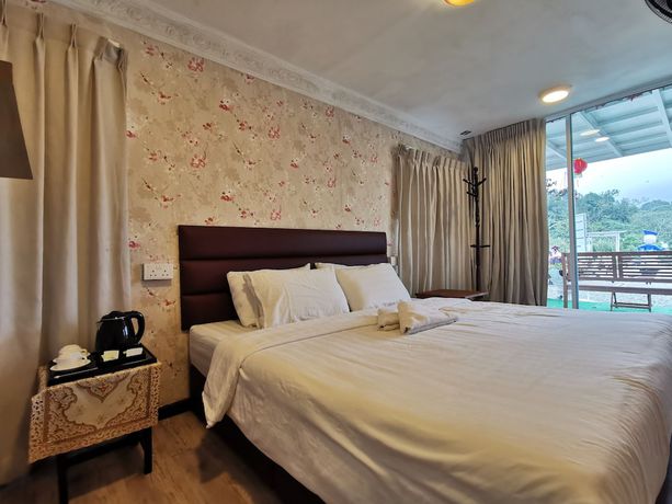 Imagen de la habitación del Hotel OYO 89969 Mount Hill Villa Kundasang. Foto 10