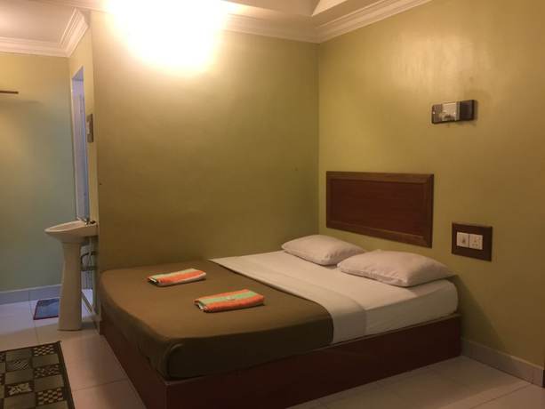 Imagen de la habitación del Hotel OYO 89976 Fins. Foto 7
