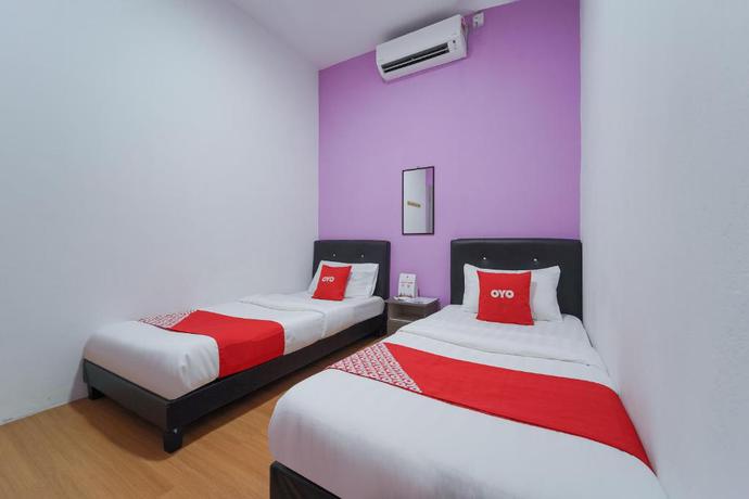 Imagen de la habitación del Hotel OYO 89982 Familia motel. Foto 6