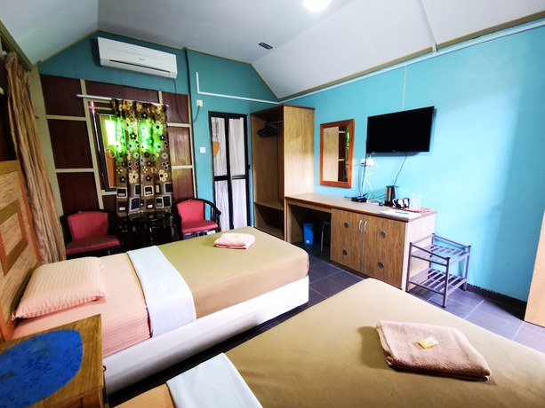Imagen de la habitación del Hotel OYO 90038 Dalyla Inn Chalet. Foto 10