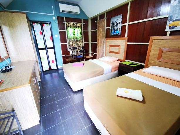 Imagen de la habitación del Hotel OYO 90038 Dalyla Inn Chalet. Foto 11
