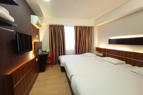 Imagen de la habitación del Hotel OYO 90091 Hi Inn. Foto 16
