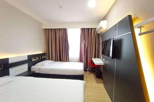 Imagen de la habitación del Hotel OYO 90091 Hi Inn. Foto 18