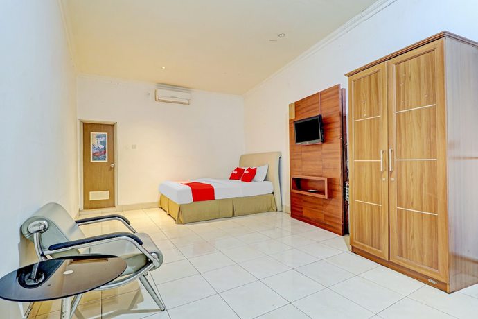 Imagen de la habitación del Hotel OYO 90218 Ubaran Guest House. Foto 3