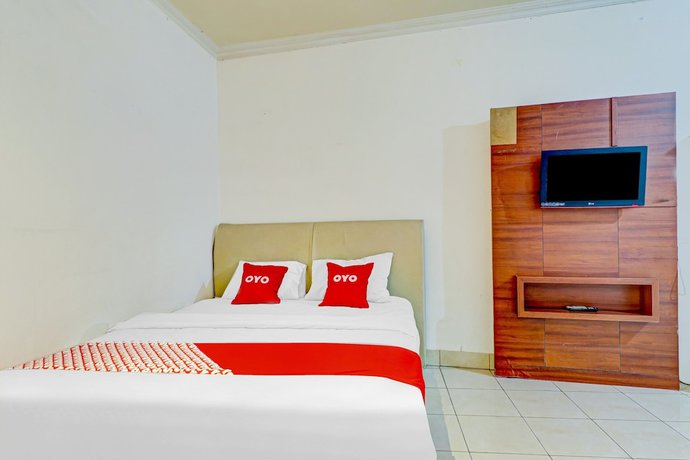 Imagen de la habitación del Hotel OYO 90218 Ubaran Guest House. Foto 8