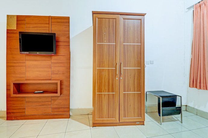 Imagen de la habitación del Hotel OYO 90218 Ubaran Guest House. Foto 9