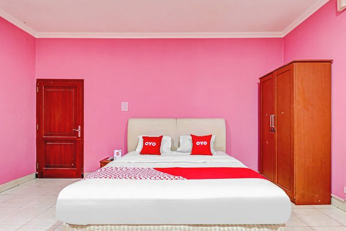Imagen de la habitación del Hotel OYO 90218 Ubaran Guest House. Foto 12