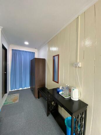 Imagen general del Hotel OYO 90230 Dh Residence. Foto 12