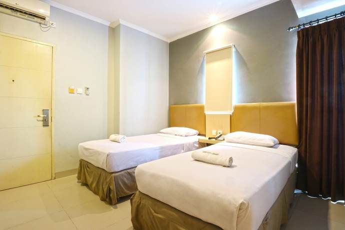 Imagen de la habitación del Hotel OYO 90244 Hotel Antara. Foto 15