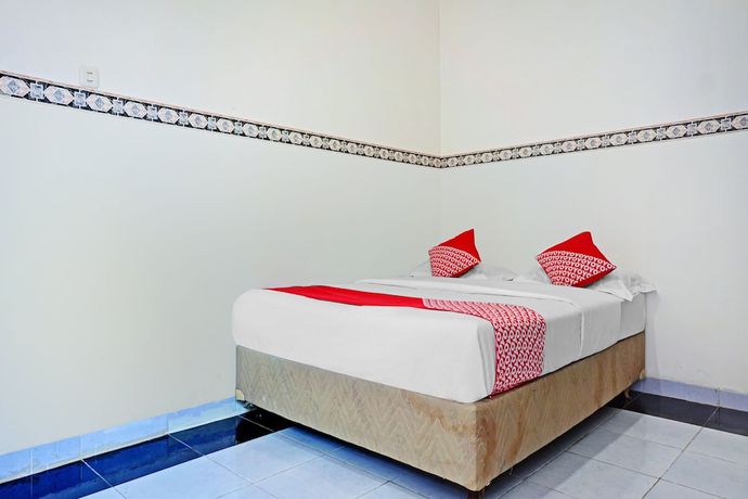 Imagen de la habitación del Hotel OYO 90260 Bumi Merpati Residence. Foto 10