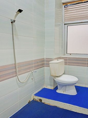Imagen de la habitación del Hotel OYO 90260 Bumi Merpati Residence. Foto 11