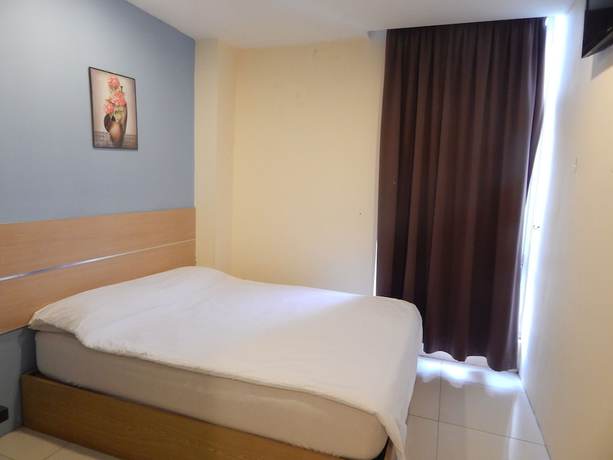 Imagen de la habitación del Hotel OYO 90270 South City. Foto 14