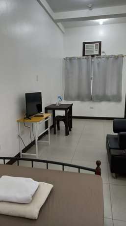 Imagen de la habitación del Hotel OYO 903 Tesoro Apartments. Foto 6
