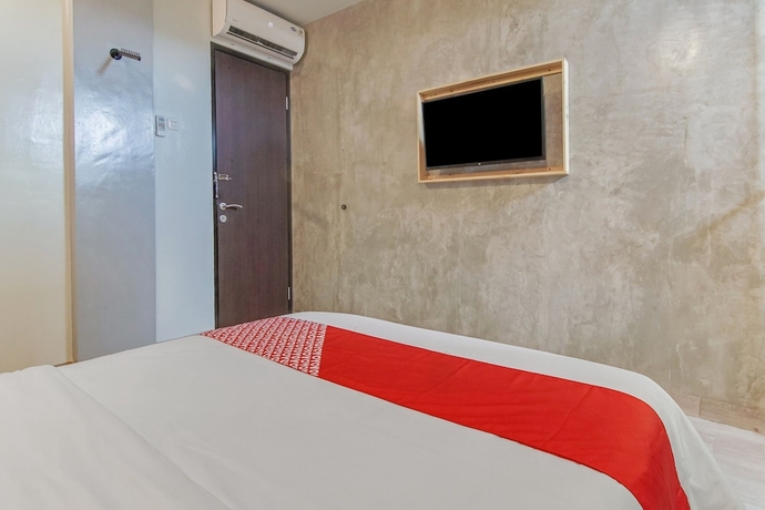 Imagen de la habitación del Hotel OYO 90305 De Umbrela Mansion Syari\'ah Ciputat. Foto 11