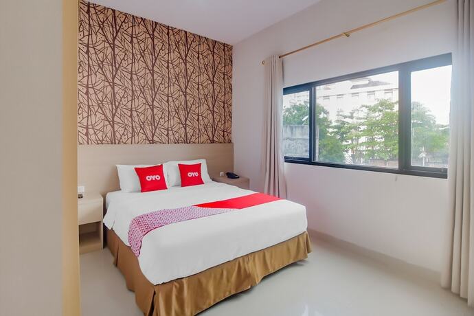 Imagen de la habitación del Hotel OYO 90312 Bahu Bay. Foto 13