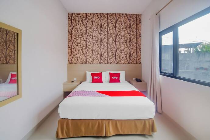 Imagen de la habitación del Hotel OYO 90312 Bahu Bay. Foto 16