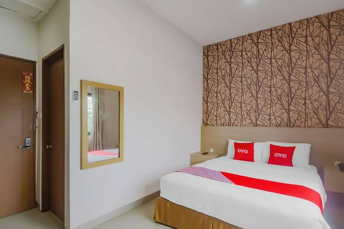 Imagen de la habitación del Hotel OYO 90312 Bahu Bay. Foto 18