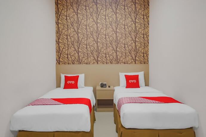 Imagen de la habitación del Hotel OYO 90312 Bahu Bay. Foto 20
