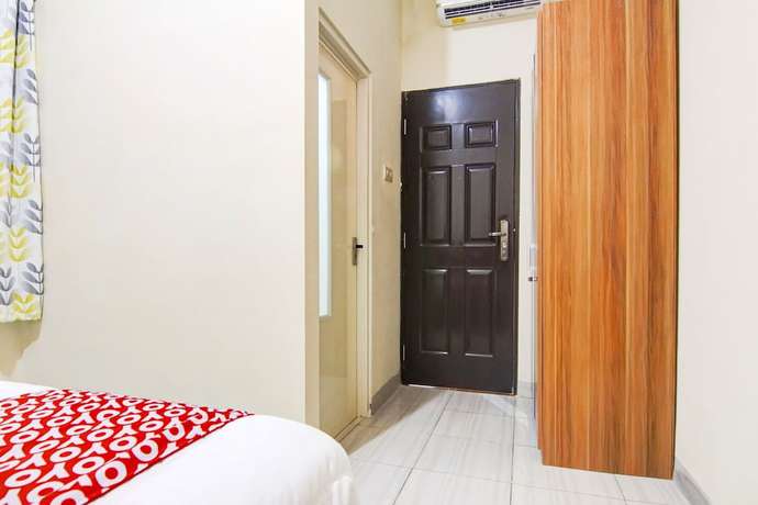 Imagen de la habitación del Hotel OYO 90322 Joy Homestay Near Bella Terra Lifestyle Center. Foto 4