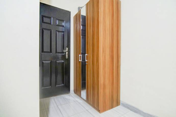 Imagen de la habitación del Hotel OYO 90322 Joy Homestay Near Bella Terra Lifestyle Center. Foto 11