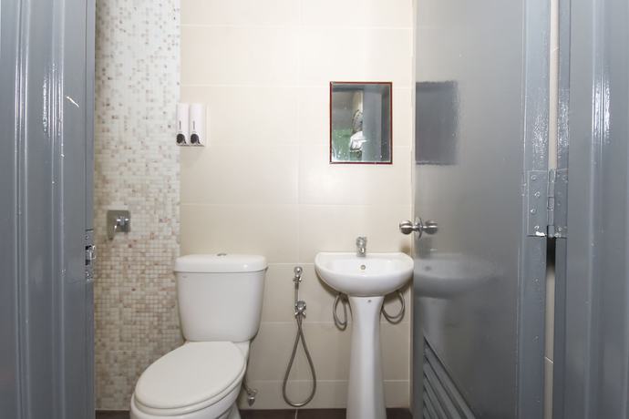 Imagen de la habitación del Hotel OYO 90345 TM. Foto 5