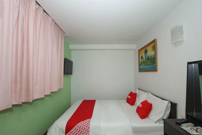 Imagen de la habitación del Hotel OYO 90345 TM. Foto 10