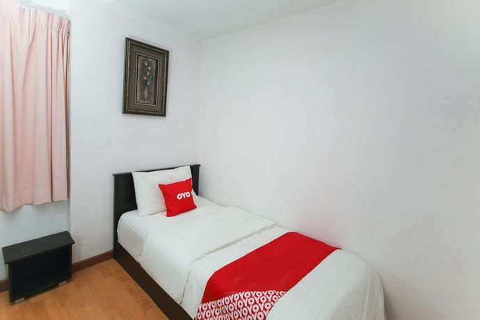 Imagen de la habitación del Hotel OYO 90345 TM. Foto 11