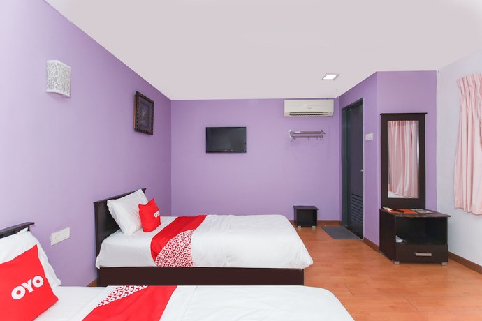 Imagen de la habitación del Hotel OYO 90345 TM. Foto 14
