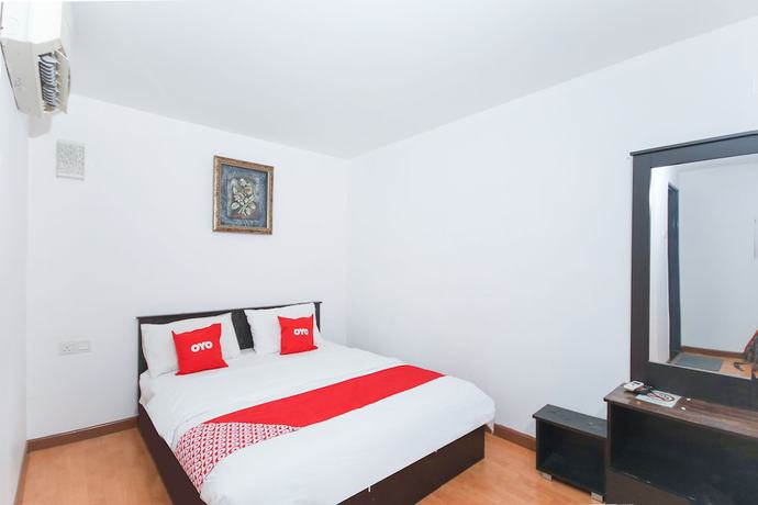 Imagen de la habitación del Hotel OYO 90345 TM. Foto 16