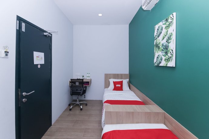 Imagen de la habitación del Hotel OYO 90399 Green Home. Foto 3