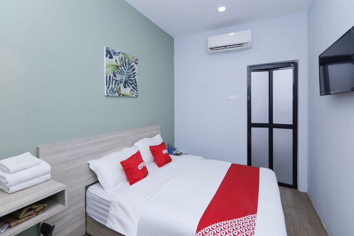 Imagen de la habitación del Hotel OYO 90399 Green Home. Foto 6