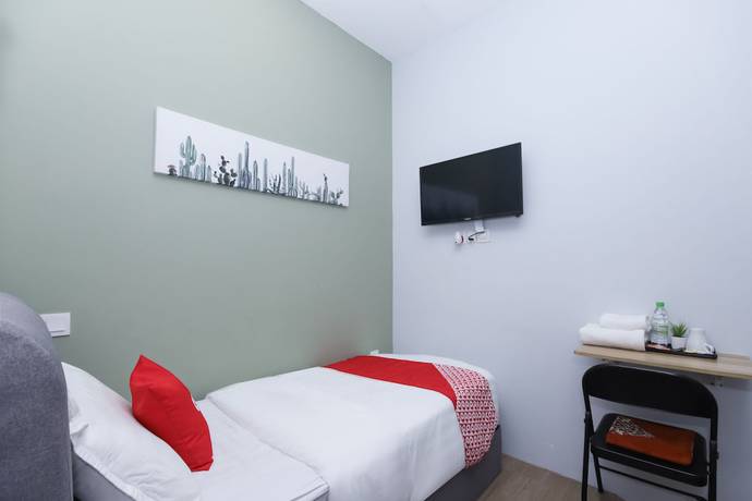 Imagen de la habitación del Hotel OYO 90399 Green Home. Foto 12