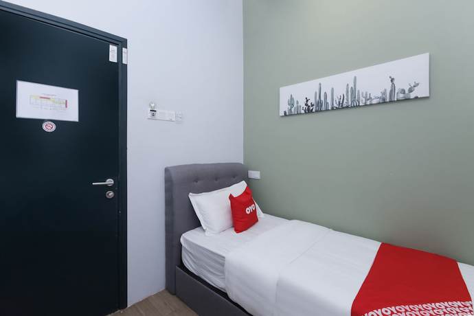 Imagen de la habitación del Hotel OYO 90399 Green Home. Foto 13