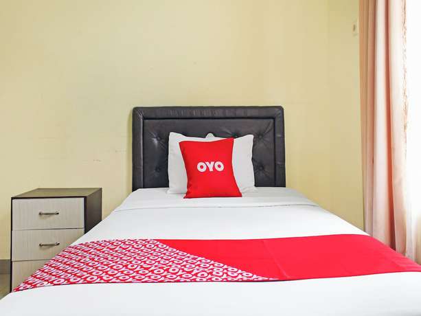 Imagen de la habitación del Hotel OYO 90423 Aman. Foto 2