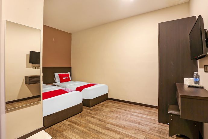 Imagen de la habitación del Hotel OYO 90474 Skycity Motel. Foto 6