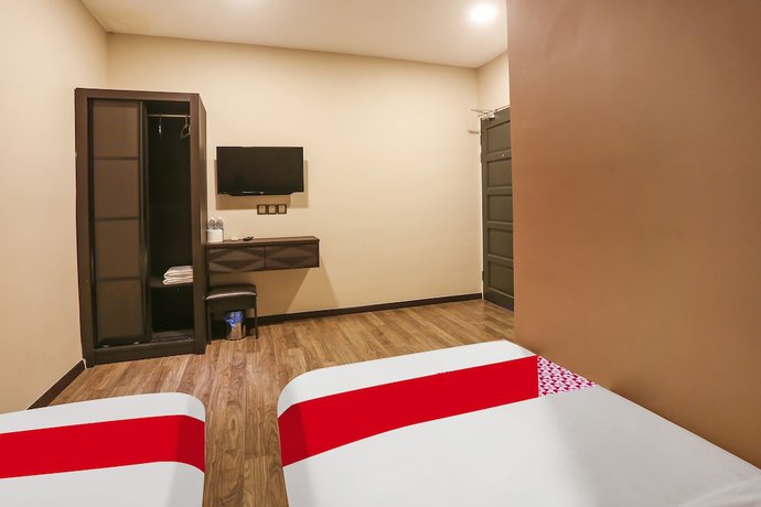 Imagen de la habitación del Hotel OYO 90474 Skycity Motel. Foto 8